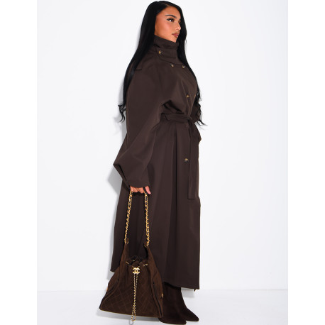 Long, oversized trench coat with a stand-up collar and a belt at the waist