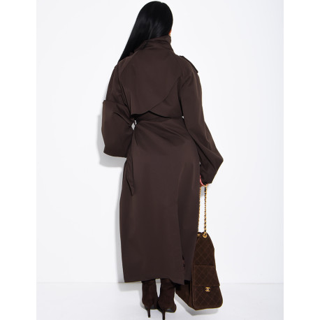 Long, oversized trench coat with a stand-up collar and a belt at the waist