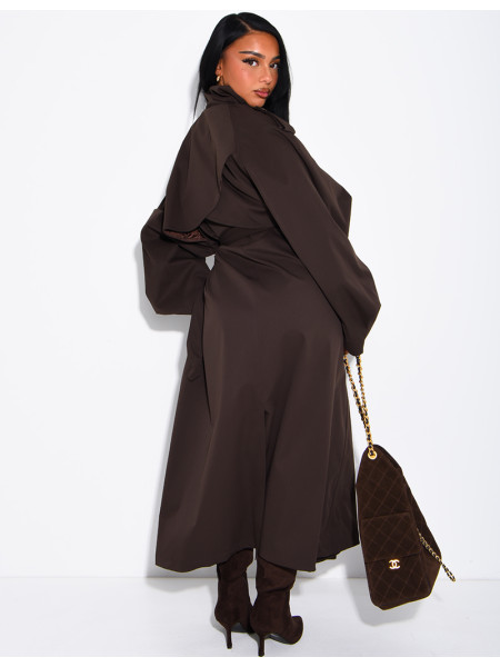 Long, oversized trench coat with a stand-up collar and a belt at the waist