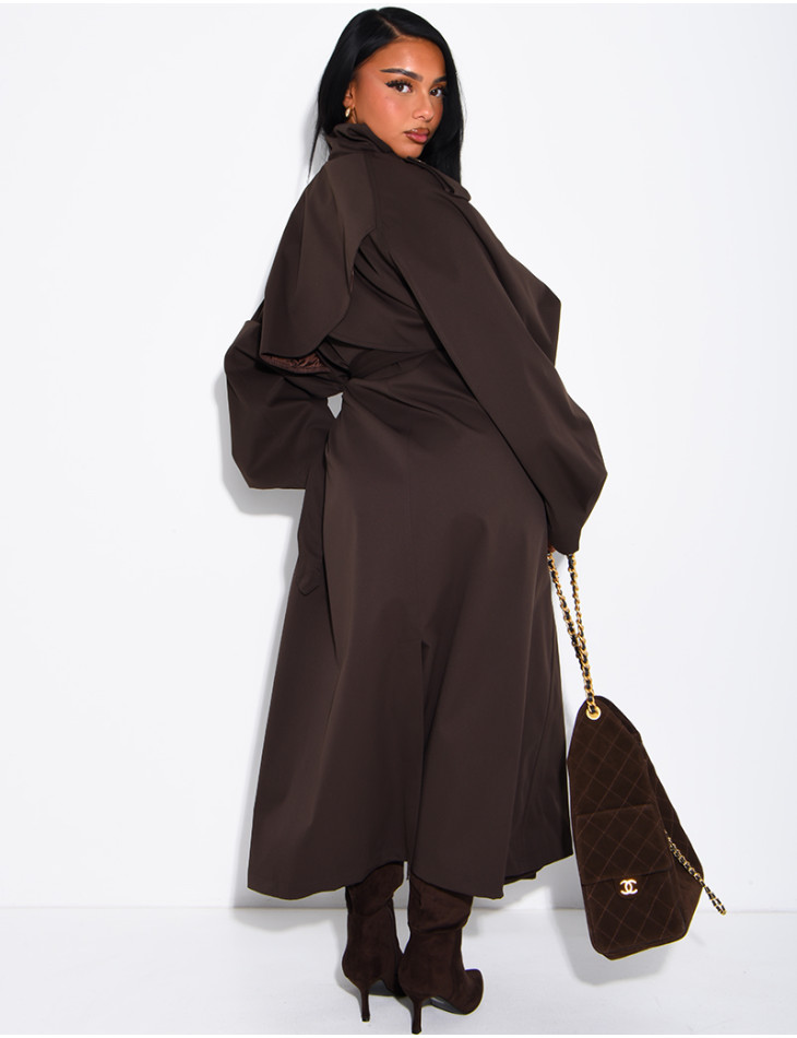 Long, oversized trench coat with a stand-up collar and a belt at the waist