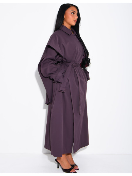 Long, oversized trench coat with a cape and waist belt
