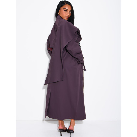 Long, oversized trench coat with a cape and waist belt