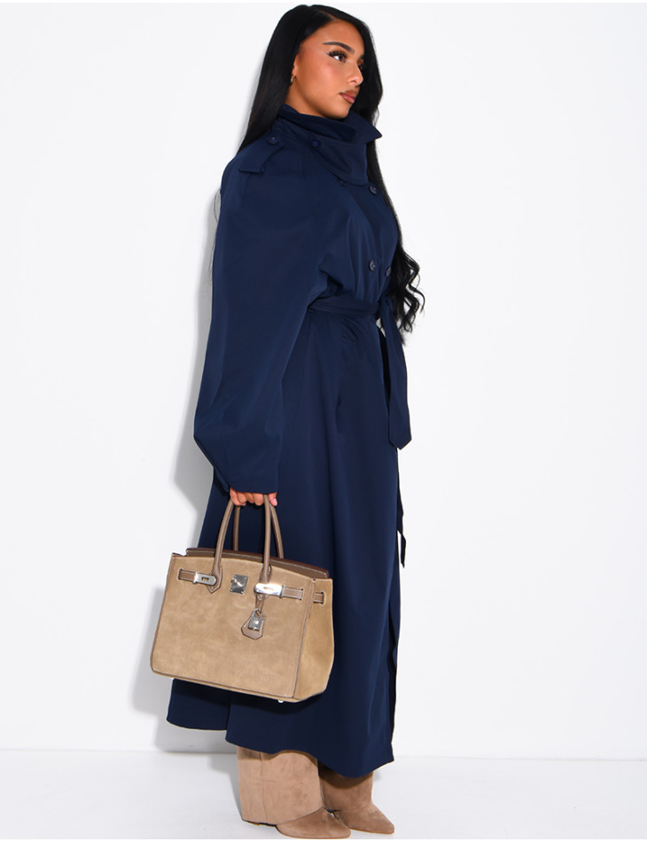 Long, oversized trench coat with a stand-up collar and a belt at the waist