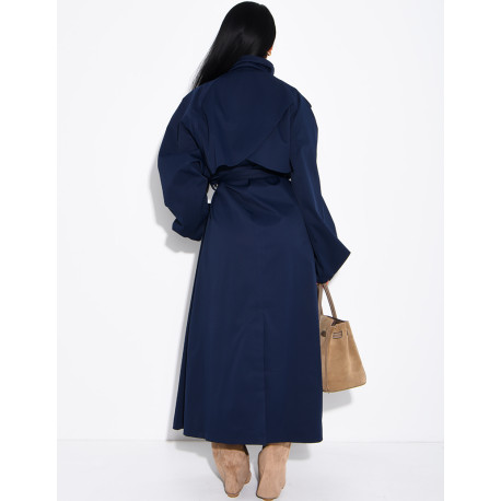 Long, oversized trench coat with a stand-up collar and a belt at the waist