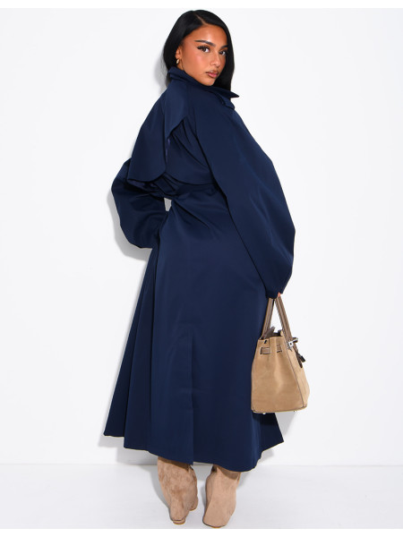 Long, oversized trench coat with a stand-up collar and a belt at the waist