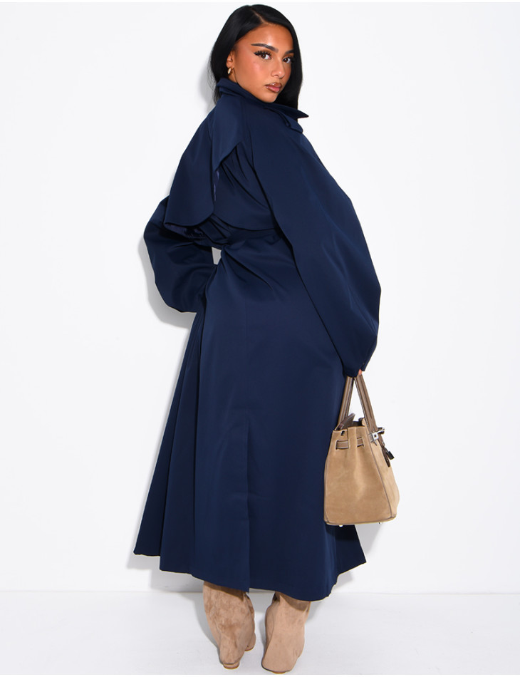Long, oversized trench coat with a stand-up collar and a belt at the waist