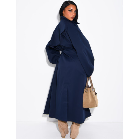 Long, oversized trench coat with a stand-up collar and a belt at the waist