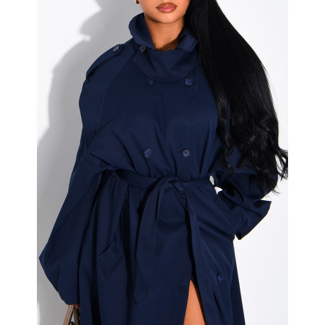 Long, oversized trench coat with a stand-up collar and a belt at the waist