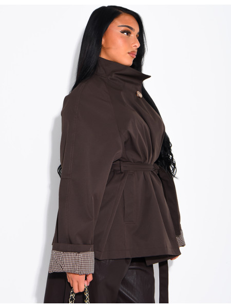 Mid-length belted trench coat with a stand-up collar, checked lapels and checked sleeves