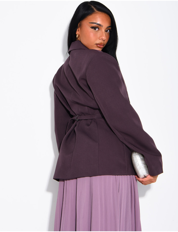 Blazer with an adjustable asymmetrical button placket in the back