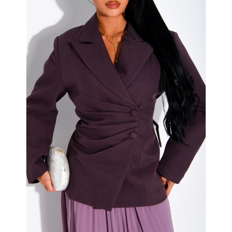 Blazer with an adjustable asymmetrical button placket in the back