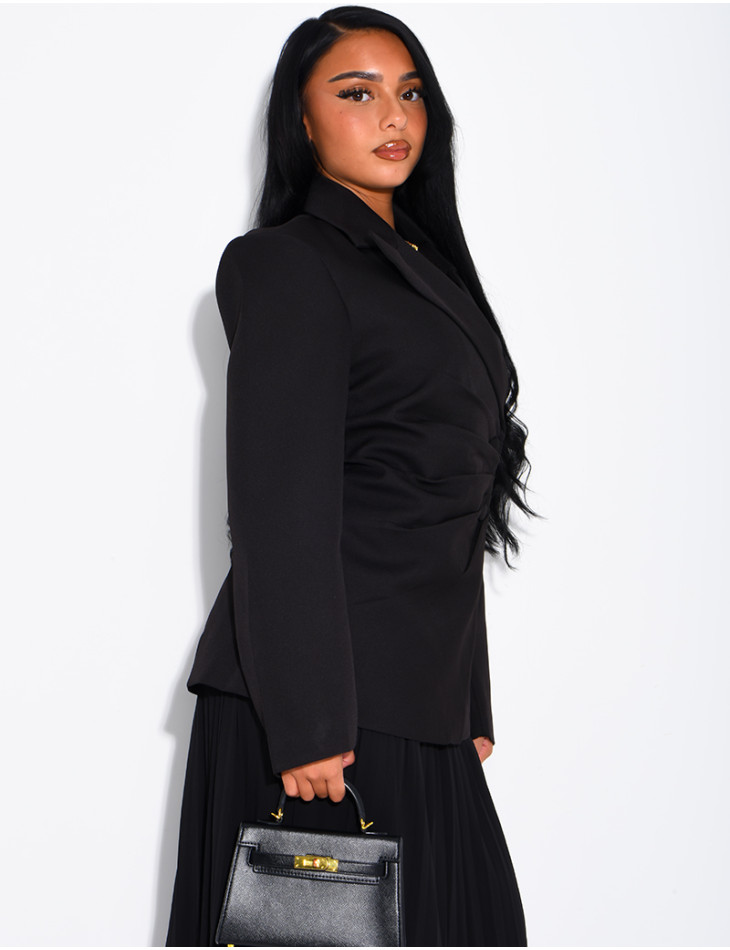 Blazer with an adjustable asymmetrical button placket in the back