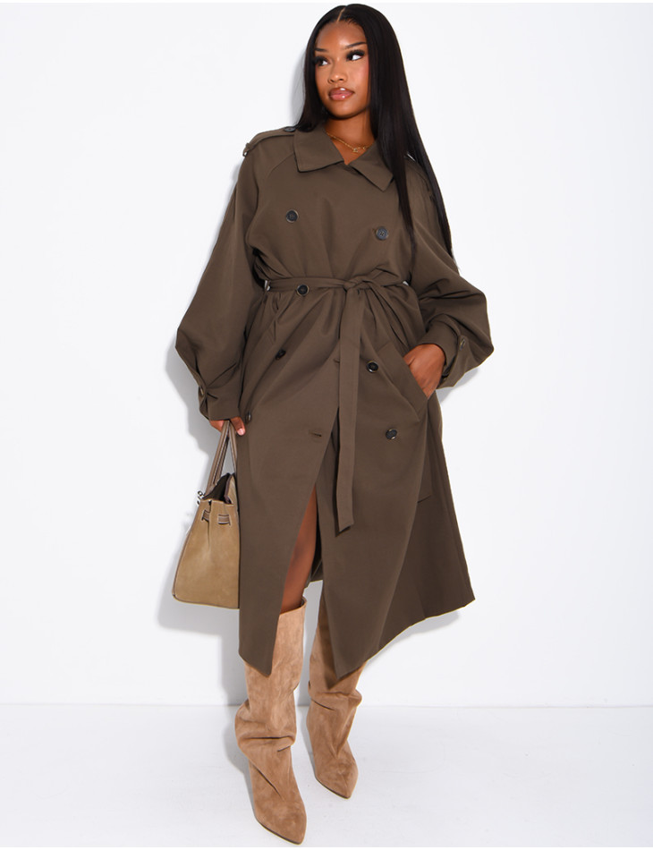 Long, oversized trench coat with a textured stand-up collar and a belt at the waist