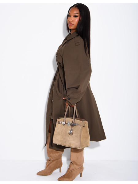 Long, oversized trench coat with a textured stand-up collar and a belt at the waist