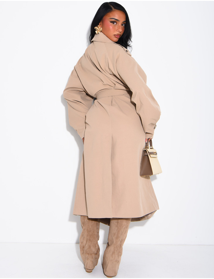 Long, oversized trench coat with a textured stand-up collar and a belt at the waist
