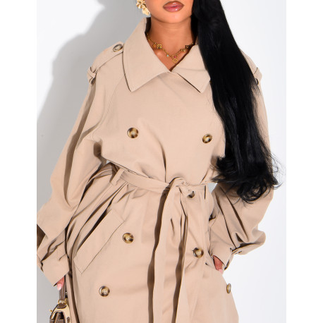 Long, oversized trench coat with a textured stand-up collar and a belt at the waist