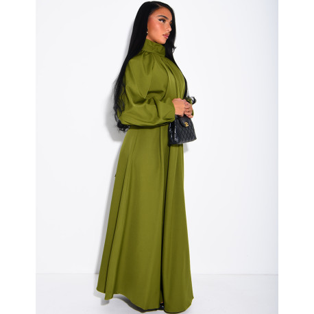 Long dress with a high neck and a wide belt at the waist