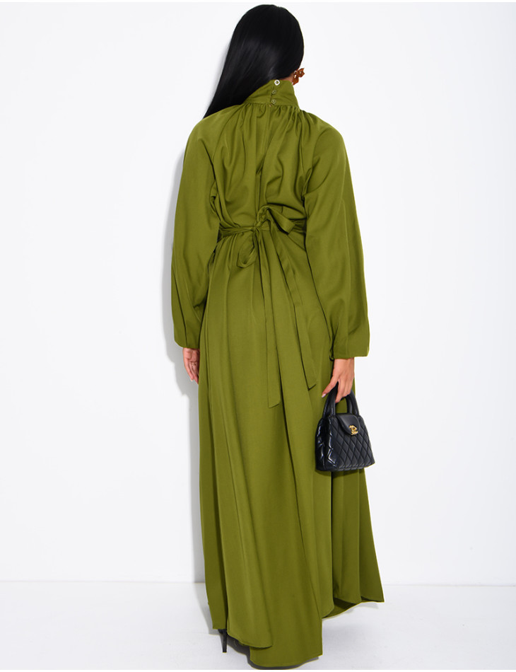 Long dress with a high neck and a wide belt at the waist