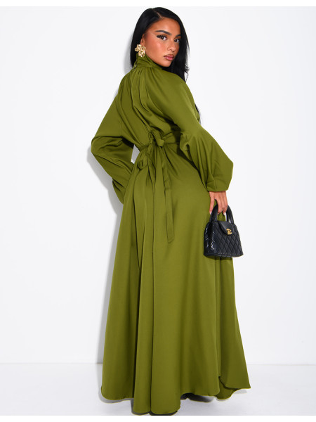 Long dress with a high neck and a wide belt at the waist
