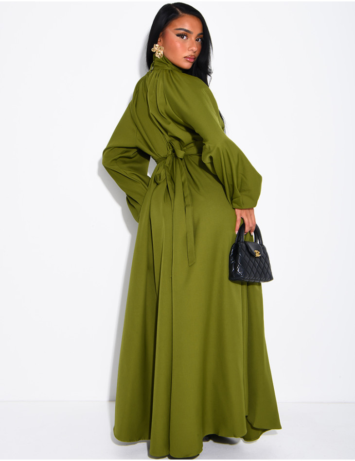 Long dress with a high neck and a wide belt at the waist