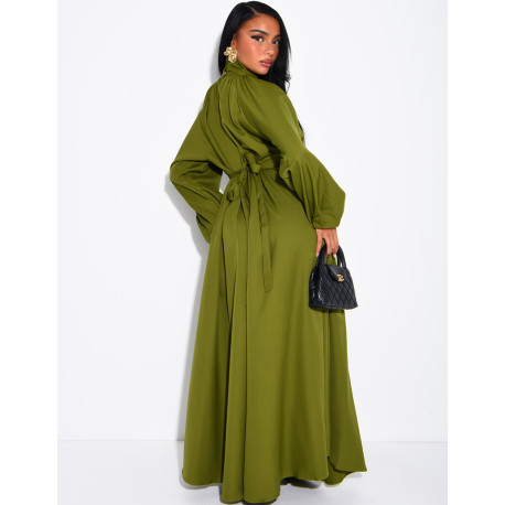 Long dress with a high neck and a wide belt at the waist