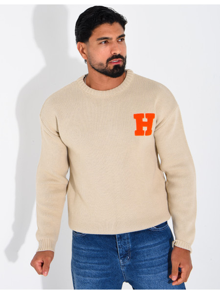 Pull en maille avec broderie lettre H