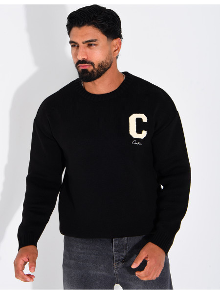 Pull en maille avec broderie lettre C