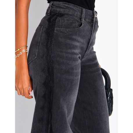 Jeans wide leg délavé à empiècements dentelle sur les côtés